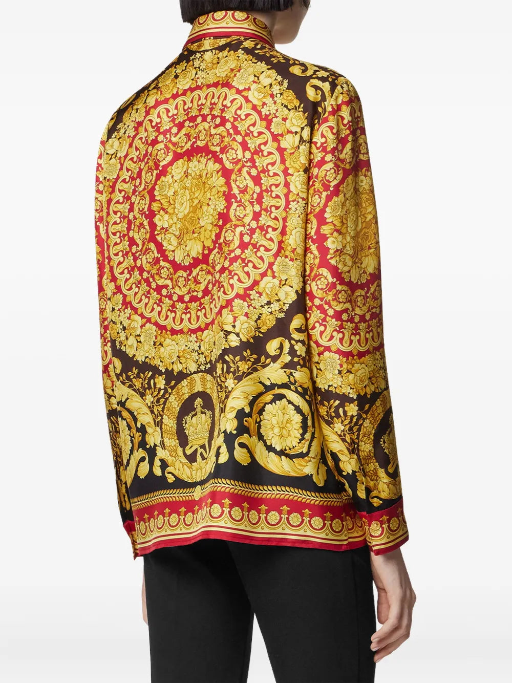Female model wearing a Versace black, gold and red '92 barocco silk blouse.