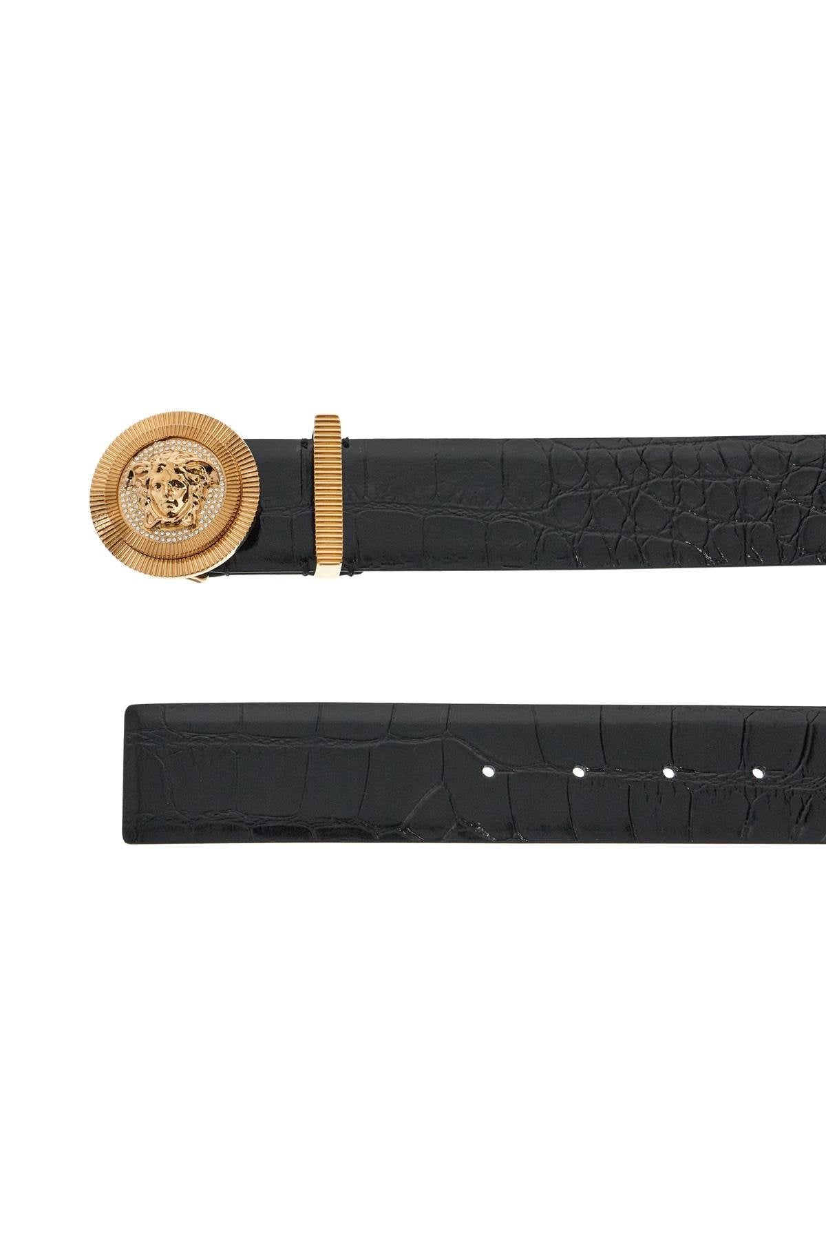 Black croc embossed leather belt with gold Medusa buckle on a white background.
