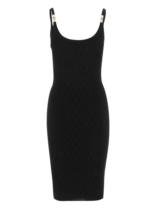 Black knit dress with thin straps on a white background.