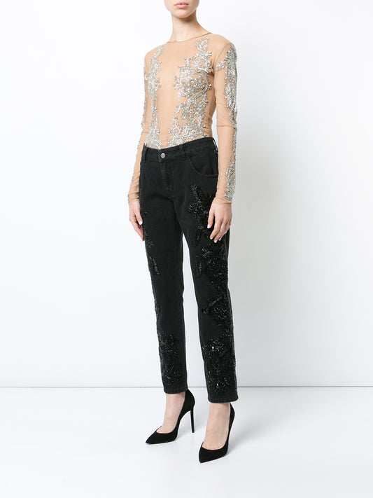 Black boyfriend jeans with beaded embellishments on both legs.