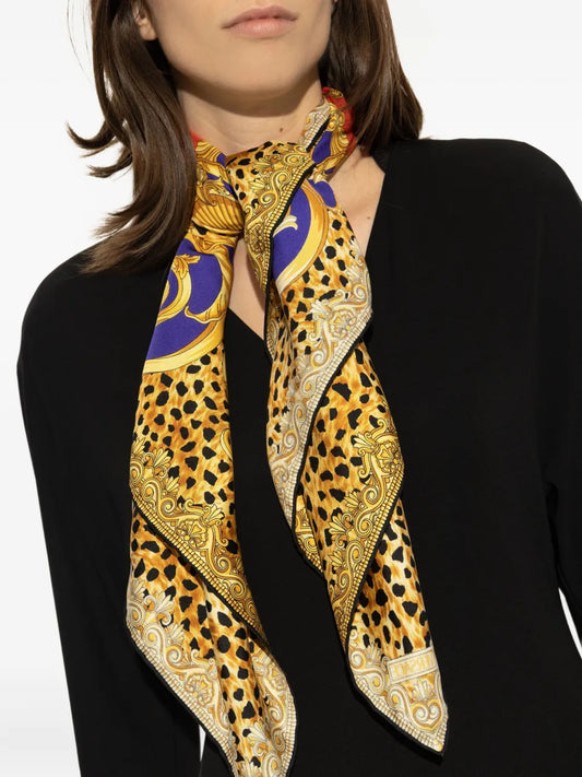 Model wearing a Versace Rock & Royalty silk scarf.