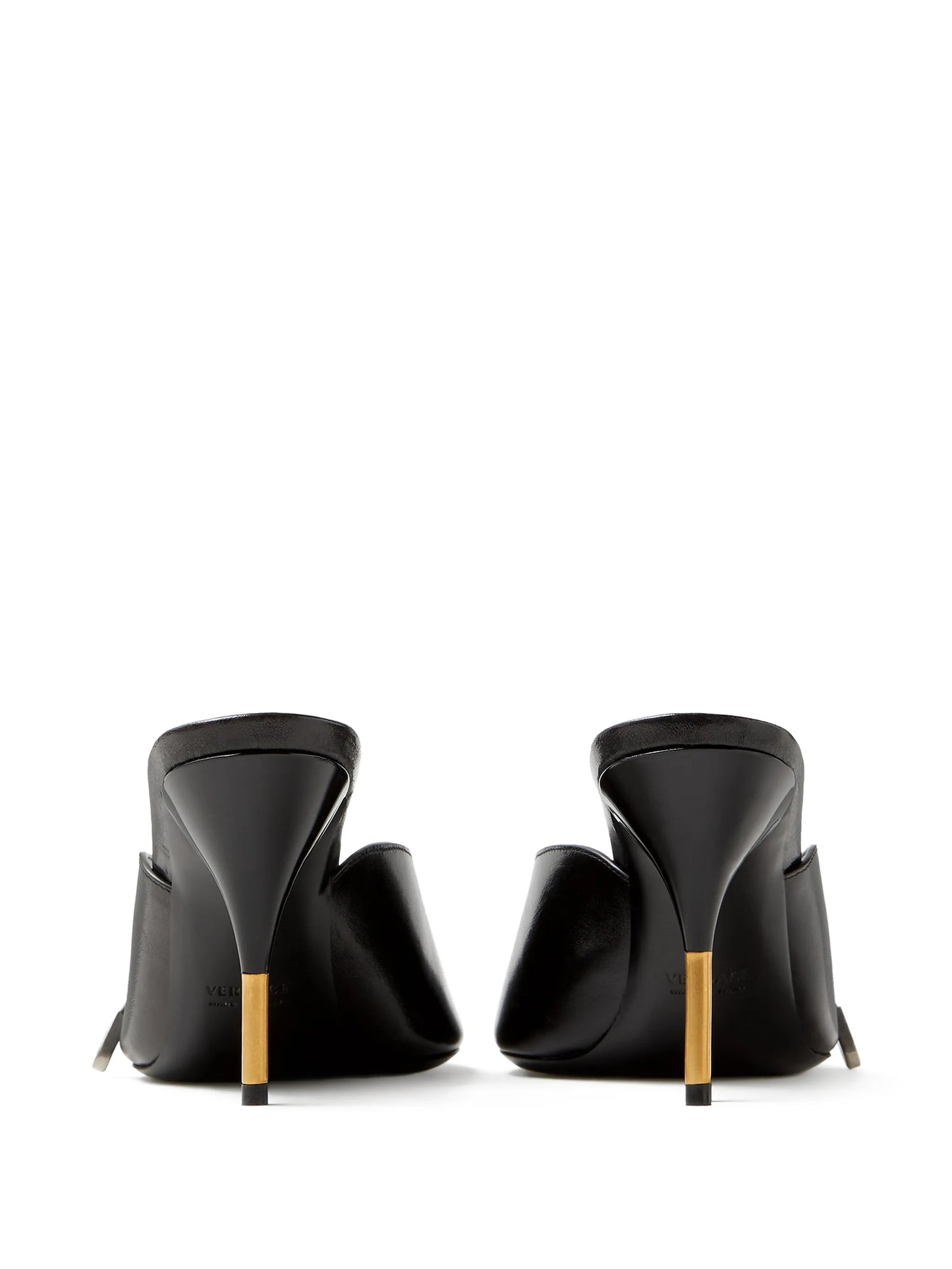 Black high-heeled Versace mules with gold accents on a white background