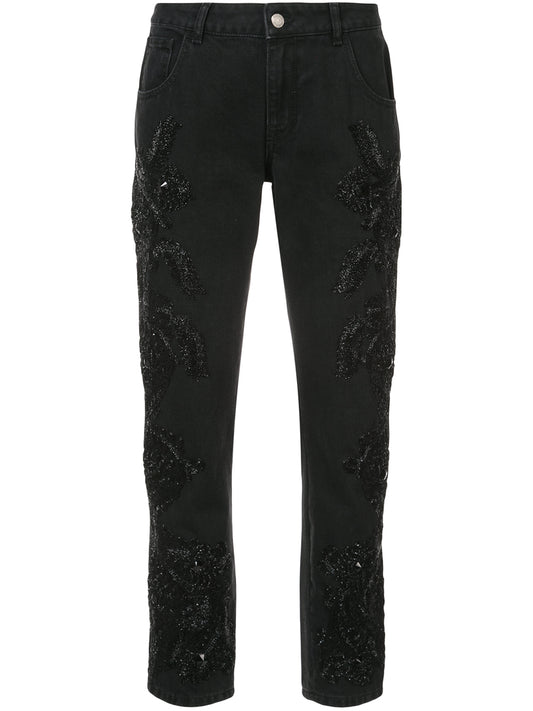 Black boyfriend jeans with beaded embellishments on both legs.