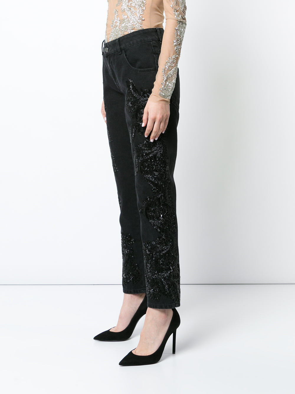 Black boyfriend jeans with beaded embellishments on both legs.