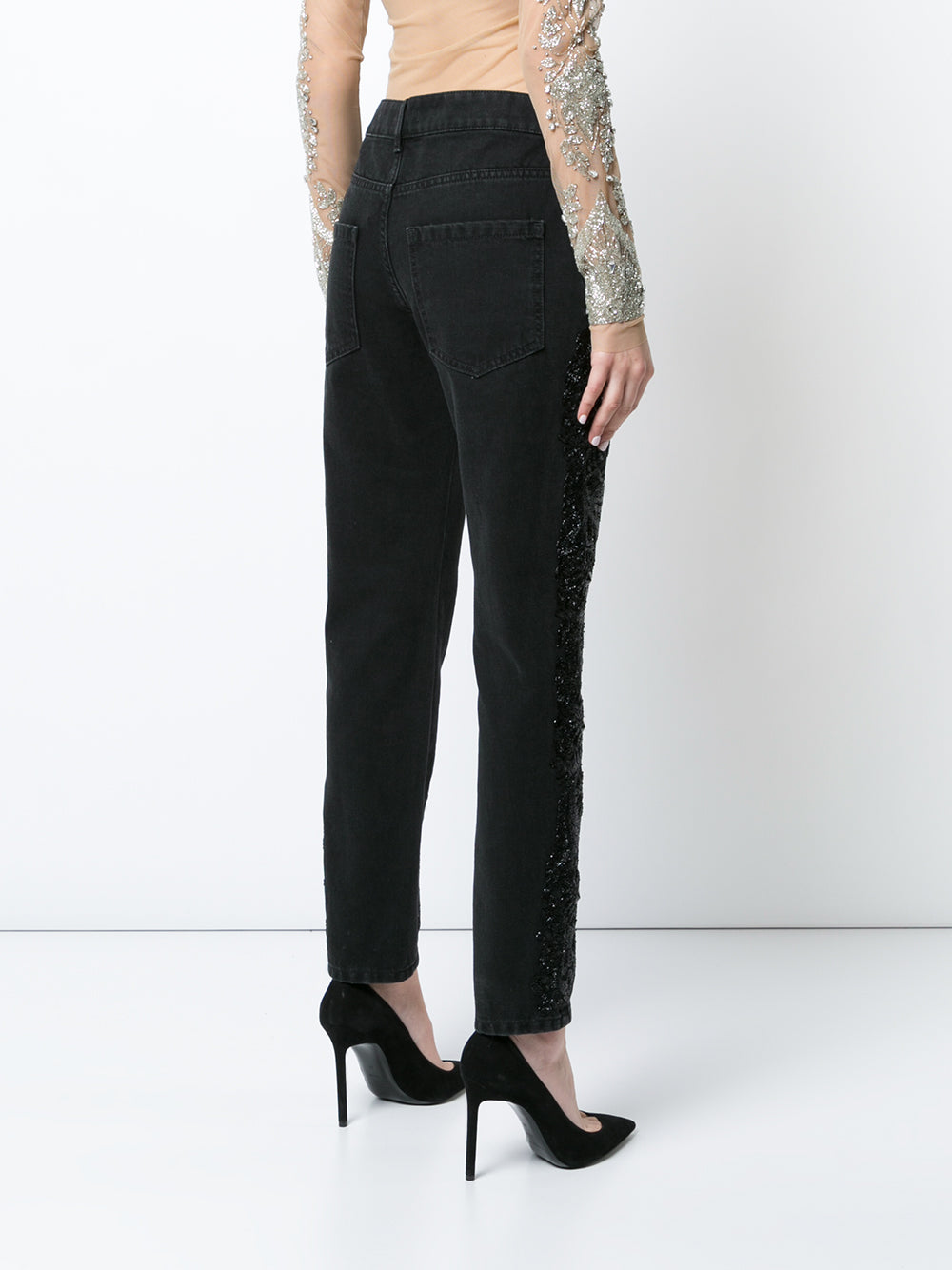 Black boyfriend jeans with beaded embellishments on both legs.