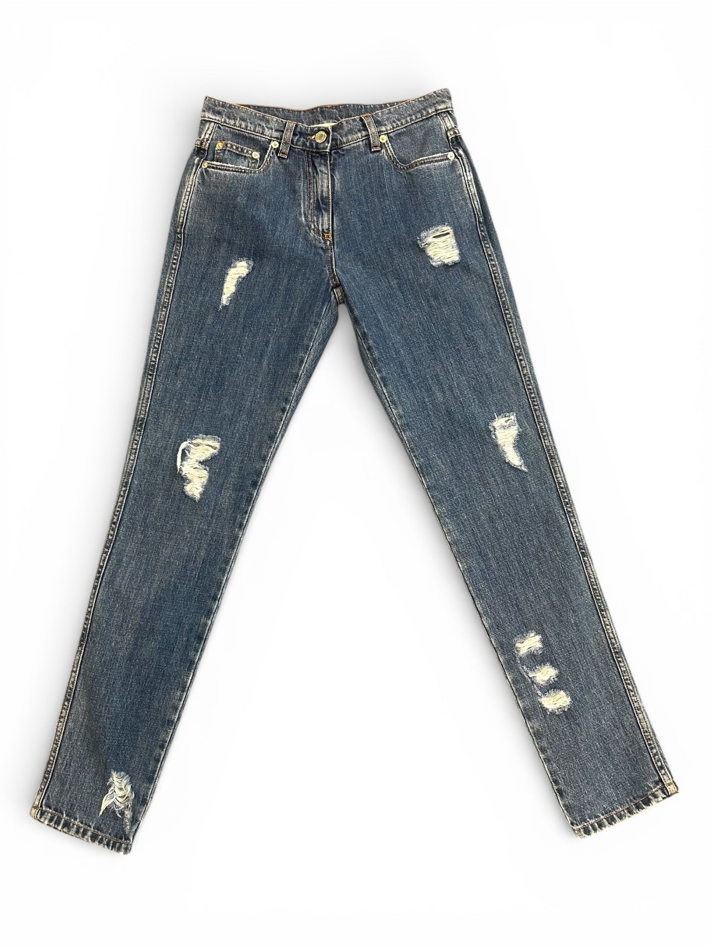 Front of distressed blue jeans.