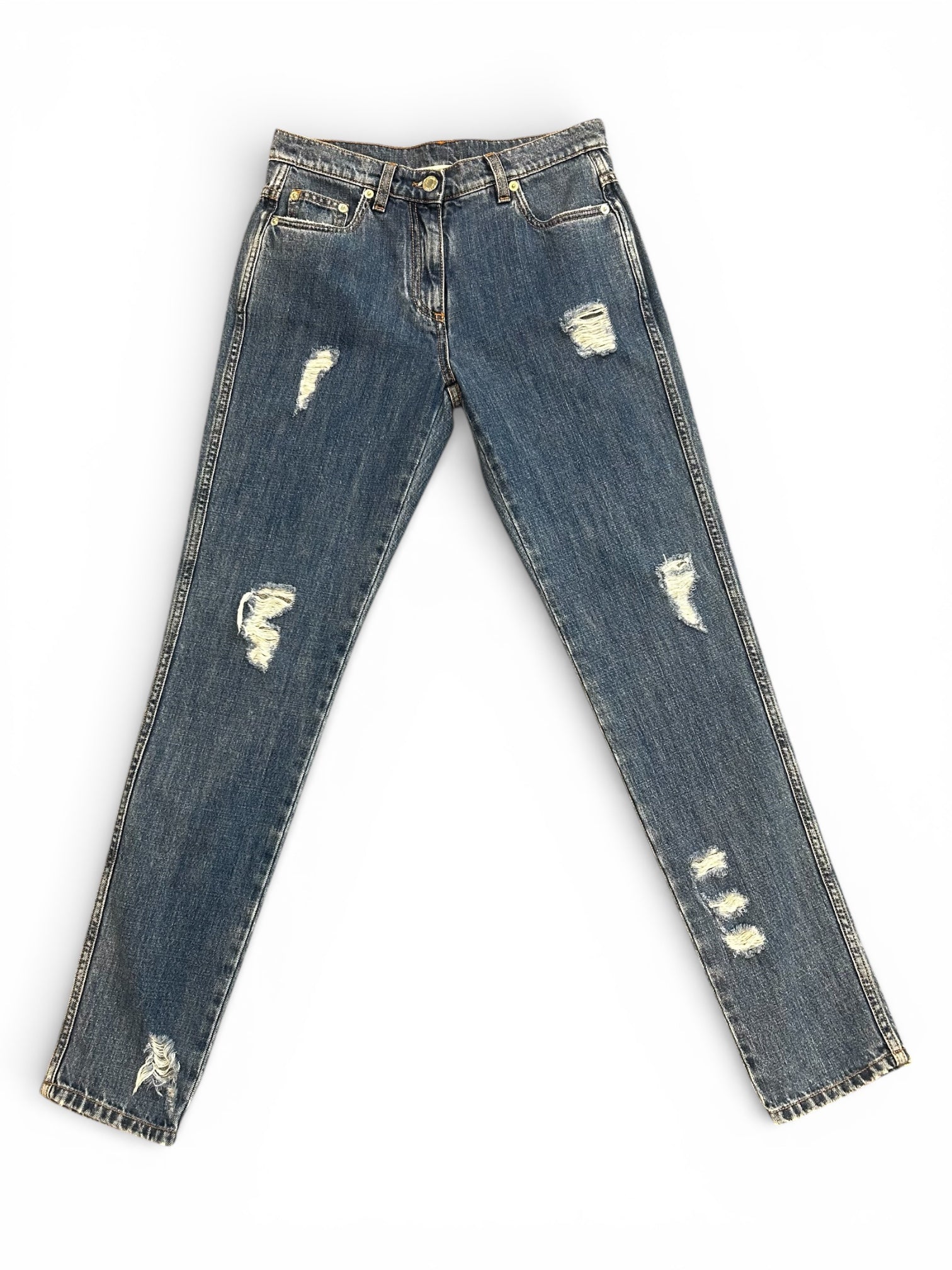 Front of distressed blue jeans.
