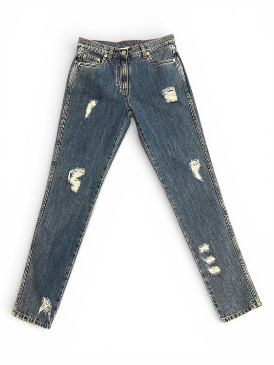 Front of distressed blue jeans.