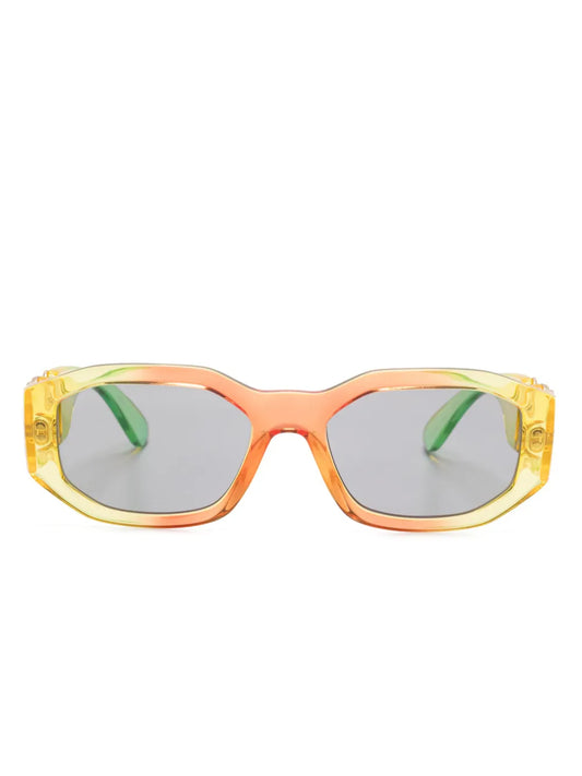 VERSACE Medusa Biggie sunglasses with a yellow, orange and green frame on a white background.