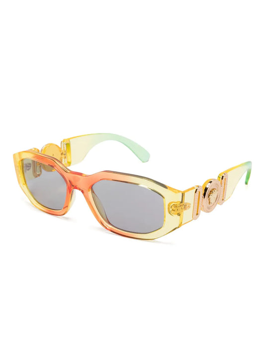 VERSACE Medusa Biggie sunglasses with a yellow, orange and green frame on a white background.